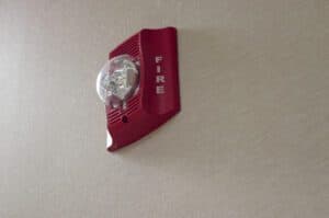 Wall mounted strobe horn unit representing audible and visual alarm alerts