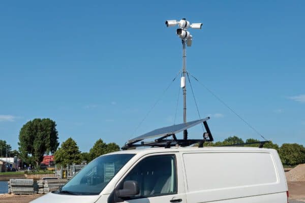 Mobile van equipped with roof rack solar panel and surveillance camera mast