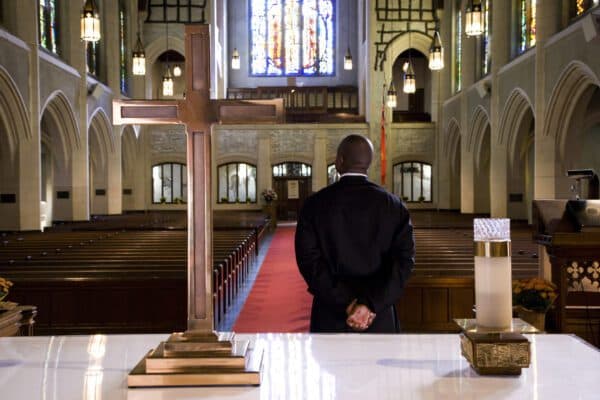 Pastor standing inside a church sanctuary