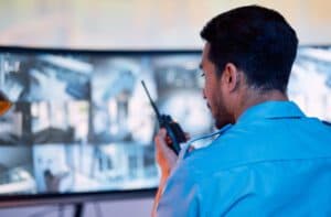 Security monitoring agent using a radio in front of video feed monitors